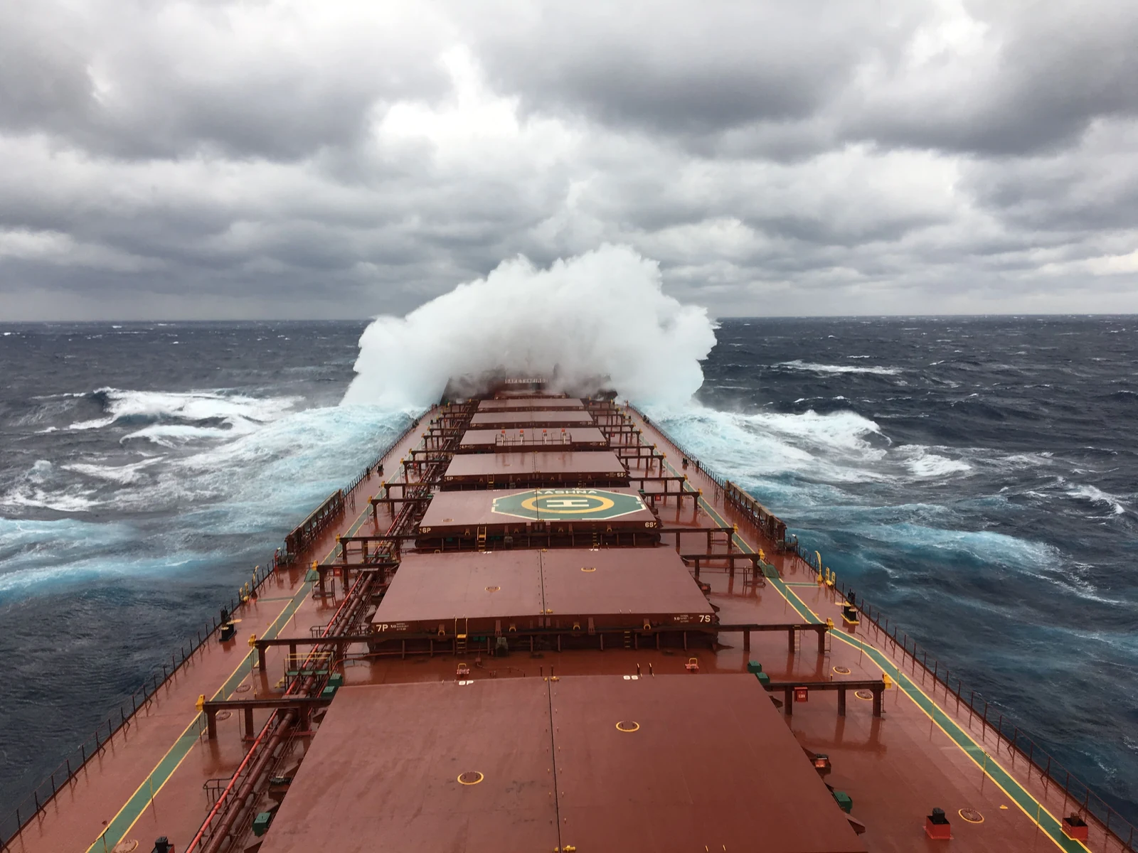 Bulk carrier navigating through heavy seas